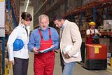 managers and senior supervisor meeting in warehouse