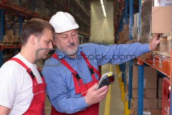 A view of a senior engineer training a newly hired employee.