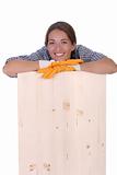 woman carpenter holding wooden plank