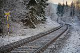 Railroad tracks in winter landscape
