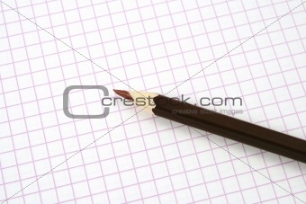 brown pencil on notepad