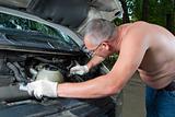 The man repairs car