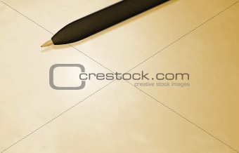 black pen above a paper