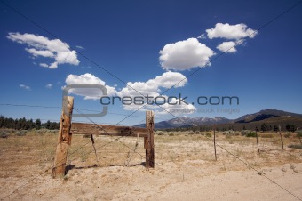 Aged Fence and Clouds