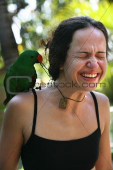 Girl with a green parrot