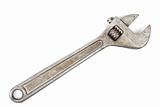 Old adjustable spanner isolated