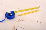 wooden plank and measuring tape 