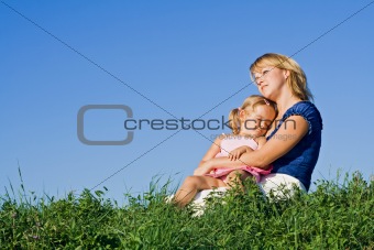 Woman and little girl enjoying sunshine
