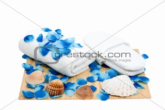 Towel and slippers for spa with sea shells