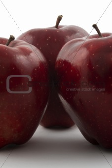 Trio of apples set against a white background