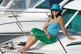 Beautiful woman aboard a yacht sunbathing