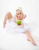 sexy young woman holding a green crispy apple