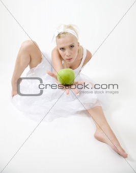 sexy young woman holding a green crispy apple