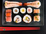 Selection of Seafood And Vegetable Sushi With Chopsticks