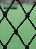 soccer field viewed through a net