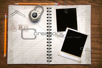 White copy book, pencils and polaroids