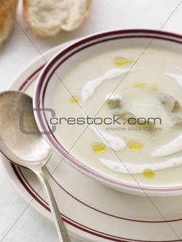 Bowl of Vichyssoise with oil and Rustic Bread