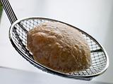 Deep Fried Puff Bread on a Strainer