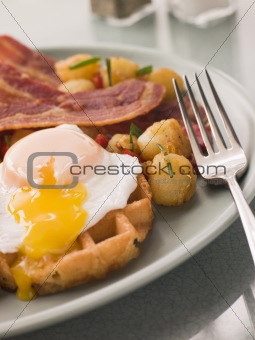 Waffles with Bacon Fried Potatoes and a Broken fried Egg
