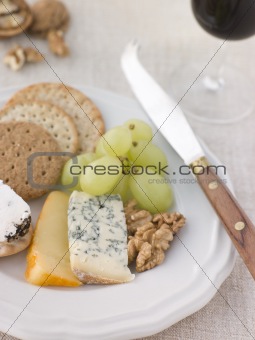 Plate of Cheese and Biscuits with a Glass of Port