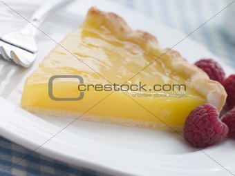 Slice of Lemon Curd Tart with English Raspberries