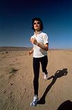 Young woman jogging in desert