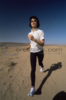Young woman jogging in desert