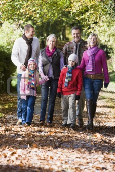 Multi-generation family walking through woods