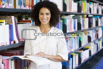Woman reading in a library
