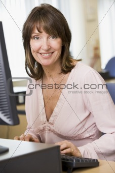 Middle aged woman working on a computer