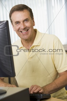 Middle aged man working on a computer