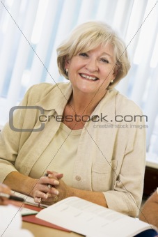 Senior woman studying on campus