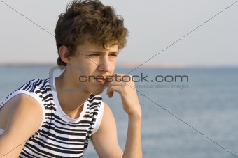 Guy looks at the sea