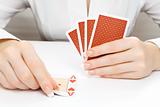 Woman putting card on the table