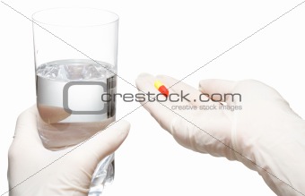Giving glass with water and pills, isolated
