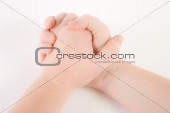 Hand clasped in prayer