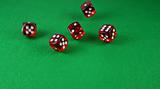 An Action shot of 5 dice thrown onto the table