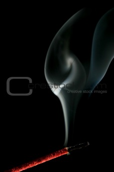 incense smoke over black
