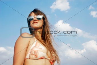 beautiful girl over sky background