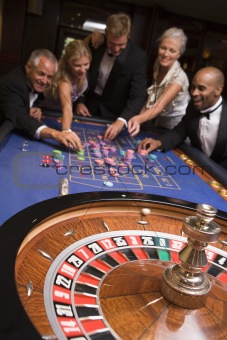 Group of friends of gambling in casino