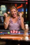 Woman winning  at roulette table