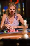 Woman concentrating at roulette table