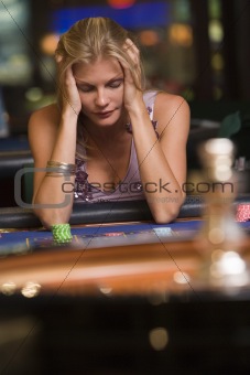 Woman losing at roulette table