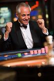 Man celebrating win at roulette table