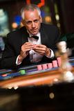 Man gambling at roulette table