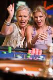 Two women gambling at roulette table