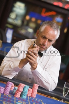 Man gambling at roulette table
