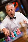 Man placing bet at roulette table