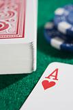 Deck of cards and chips with ace of hearts