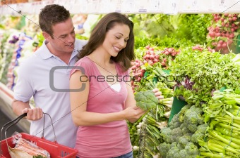 Couple shopping in produce section